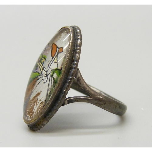 7063 - Thoms L. Mott, an Art Deco silver ring with butterfly wing inlay and painted scene depicting a lady ... 