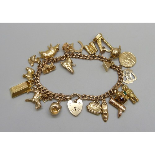 7237D - A 9ct gold curb chain bracelet with padlock clasp, with a collection of 9ct gold charms, a 15ct gold...