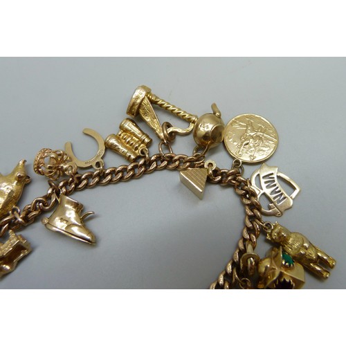 7237D - A 9ct gold curb chain bracelet with padlock clasp, with a collection of 9ct gold charms, a 15ct gold... 