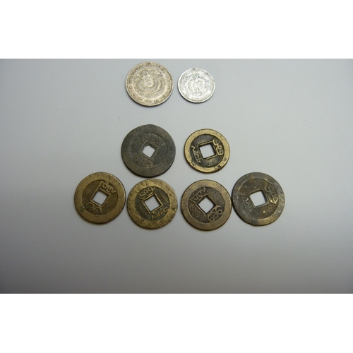 7026 - A collection of Chinese cash coins, and two silver Chinese coins (8g)