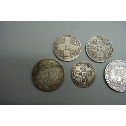 7028 - Five British 19th century silver coins including florins and half crowns, some a/f, 55.2g