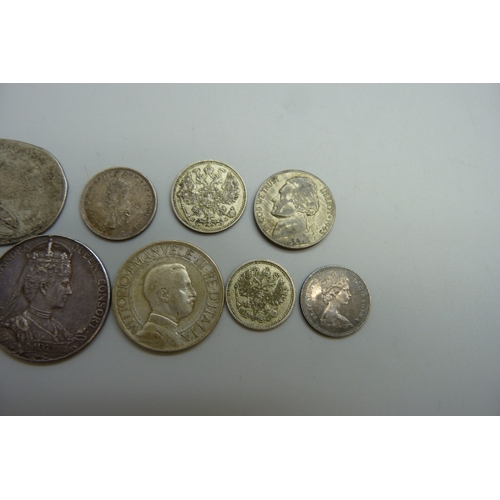 7044 - A collection of coins including Australia, Canada, Russia, an Italian 2 lire, and a British medallio... 