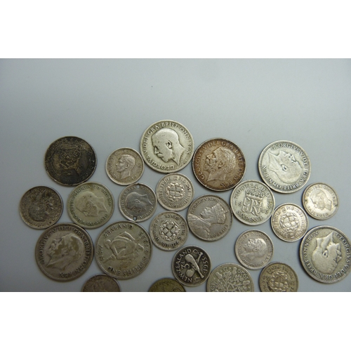 7054 - A collection of half silver coins, 64g