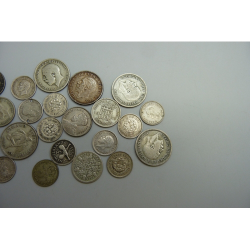 7054 - A collection of half silver coins, 64g
