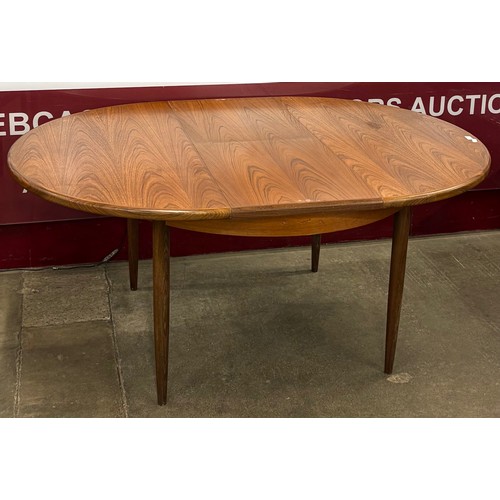 5 - A G-Plan Fresco teak circular extending dining table and three chairs
