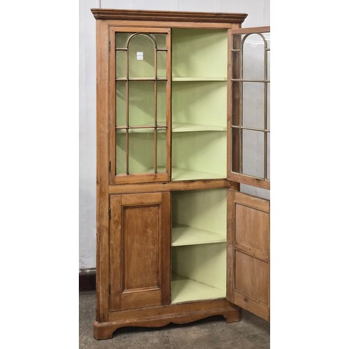 71 - A George III pine freestanding splay front corner cupboard