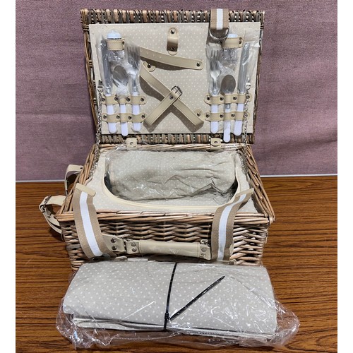 3066 - A wicker picnic basket and cutlery