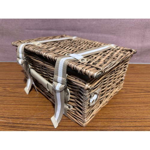 3066 - A wicker picnic basket and cutlery