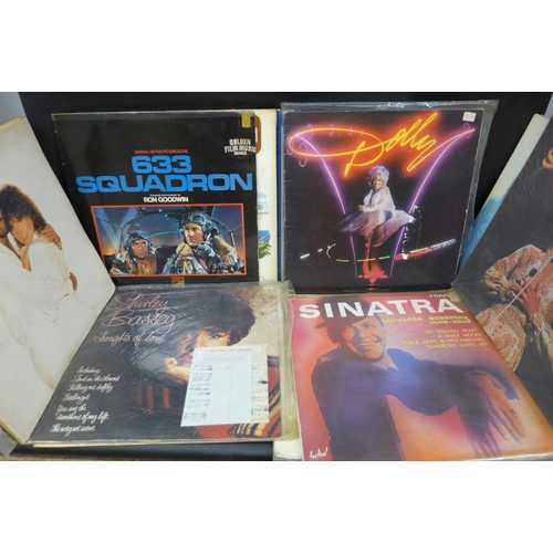 2057 - A collection of vinyl records to include The Beatles, The Cars, Shirley Bassey, Fleetwood Mac, etc.