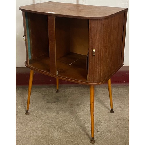 64 - A teak tambour front record cabinet