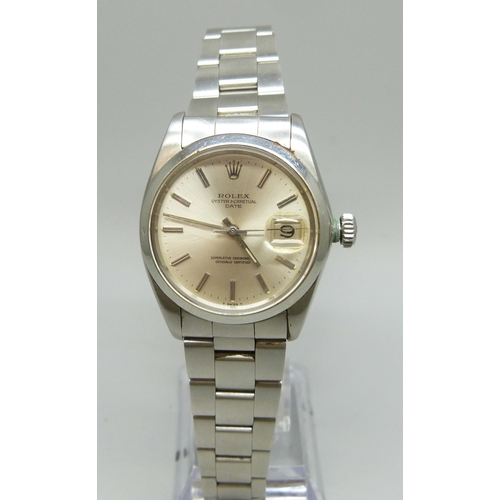 7308 - A Rolex Oyster Perpetual date wristwatch with stainless steel case, silvered dial, automatic movemen...