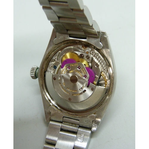 7308 - A Rolex Oyster Perpetual date wristwatch with stainless steel case, silvered dial, automatic movemen... 