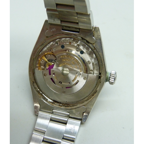7308 - A Rolex Oyster Perpetual date wristwatch with stainless steel case, silvered dial, automatic movemen... 
