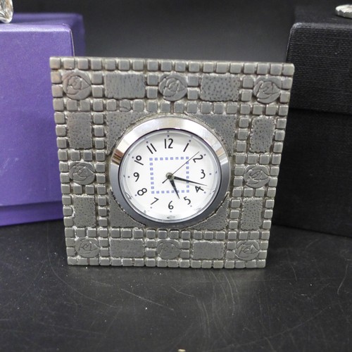 2036 - Rennie Mactintosh Pewter clock, silver scenes plated clock and a A.E Williams pewter cat figure grou... 