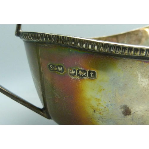 7022 - A pair Edward VIII silver sauce jugs, Sheffield, 1936, 319g, 16.5cm including handle
