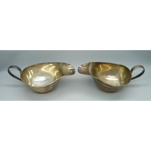 7022 - A pair Edward VIII silver sauce jugs, Sheffield, 1936, 319g, 16.5cm including handle
