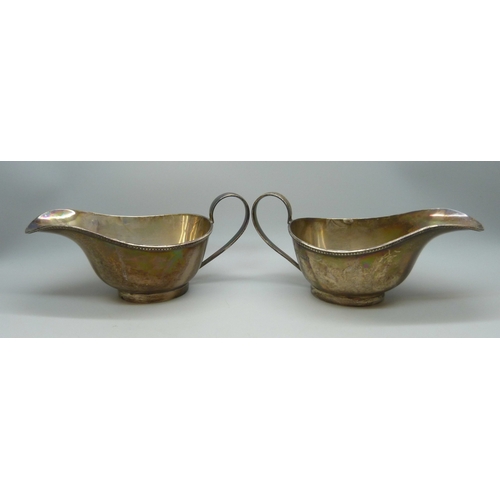 7022 - A pair Edward VIII silver sauce jugs, Sheffield, 1936, 319g, 16.5cm including handle