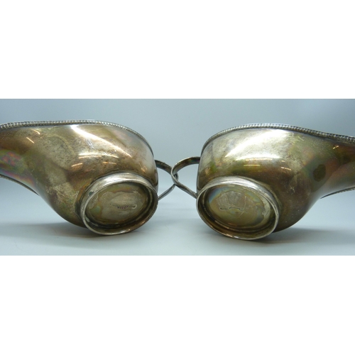 7022 - A pair Edward VIII silver sauce jugs, Sheffield, 1936, 319g, 16.5cm including handle