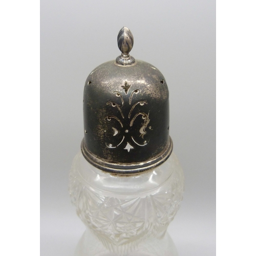 7025 - A George V silver topped cut glass sugar shaker, Birmingham, 1918, 39g silver lid, 18.2cm tall