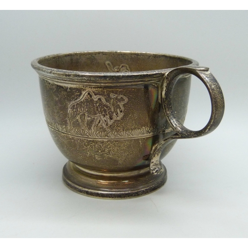 7028 - A silver christening mug with animal design, slightly misshapen, Birmingham, 1977, 94g, 6.2cm to top... 