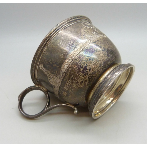 7028 - A silver christening mug with animal design, slightly misshapen, Birmingham, 1977, 94g, 6.2cm to top... 