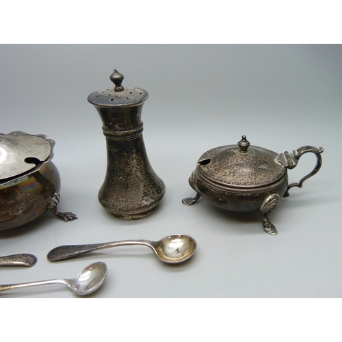 7029 - A collection of unmatched silver cruet pots, 108g of silver without liners, one with liner stuck ins... 