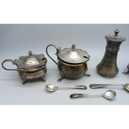 7029 - A collection of unmatched silver cruet pots, 108g of silver without liners, one with liner stuck ins... 
