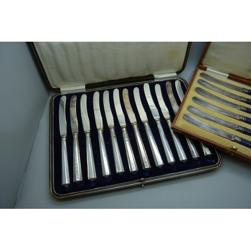 7032 - Two boxes of knives, the larger set with silver covered handles, and the other set with silver ferru... 