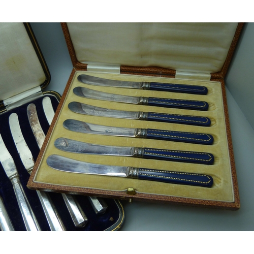 7032 - Two boxes of knives, the larger set with silver covered handles, and the other set with silver ferru... 