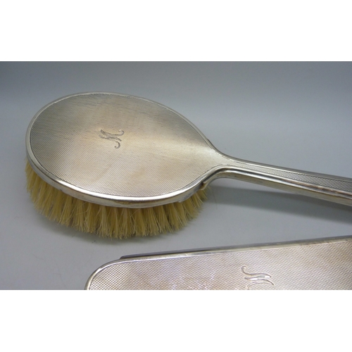 7035 - Two Mappin & Webb silver backed brushes, and an unmatched silver mounted comb, all with monograms, 2... 