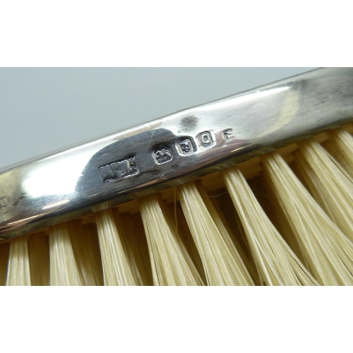 7035 - Two Mappin & Webb silver backed brushes, and an unmatched silver mounted comb, all with monograms, 2... 