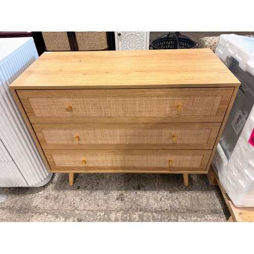 3126 - An oak and rattan 3 drawer chest with brass effect handles