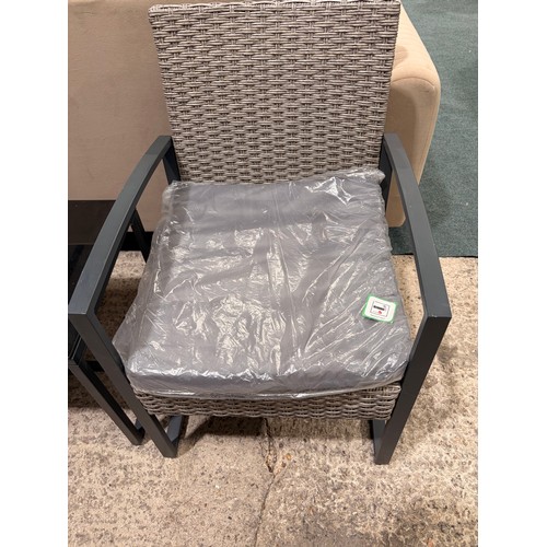 3129 - A three piece rattan bistro set