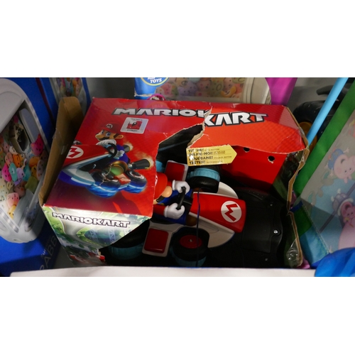 5023 - A large assortment of toys including ride on tractor, mono kart R/C racer, Chuckle Chums, Surprise G... 