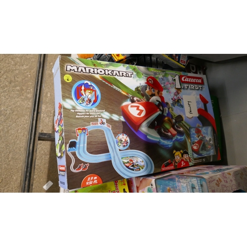 5023 - A large assortment of toys including ride on tractor, mono kart R/C racer, Chuckle Chums, Surprise G... 