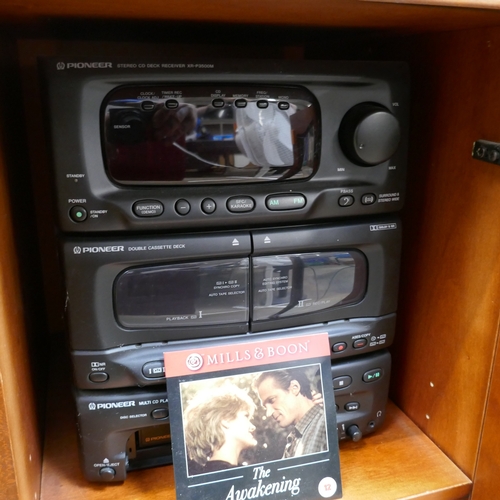 5033 - A stereo display cabinet with CD rack, a Pioneer mini Hi-Fi system and a Bush radio