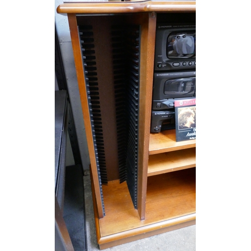 5033 - A stereo display cabinet with CD rack, a Pioneer mini Hi-Fi system and a Bush radio