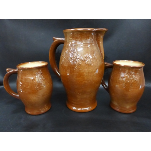2002 - A Royal Doulton golfing scene ale jug and two similar mugs