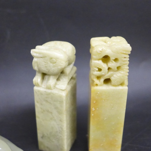 2019A - A pair of Chinese carved ink stamps, a small bronze fish, Buddha figure and a dragon