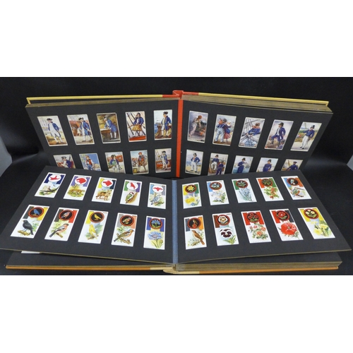 2021 - Cigarette cards; two albums of Player's cigarette cards containing twelve sets