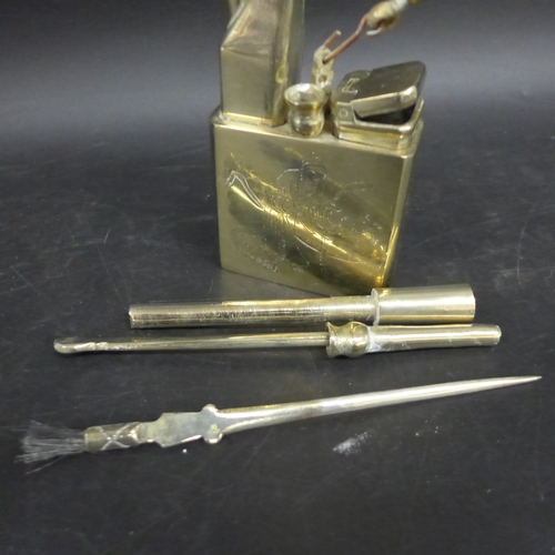2027 - A Chinese metal opium water pipe, engraved figures and Chinese characters, 21.5cm h