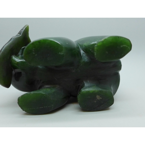 2030 - A carved green nephrite bear figure with fish, 6cm h