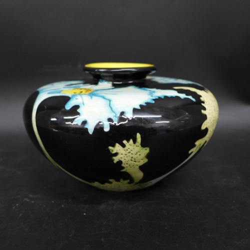 2031 - A Black Ryden Pottery vase in Papaver pattern, designed by Kerry Goodwin, of squat form, approx. 9cm... 