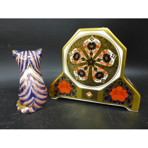 2033 - A Royal Crown Derby cat paperweight with silver stopper and a Royal Crown Derby Imari clock case