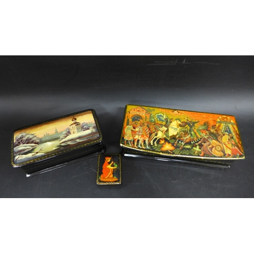 2043 - Three Russian black lacquered boxes with hand-painted scenes on lids, each signed by artist (one a/f... 