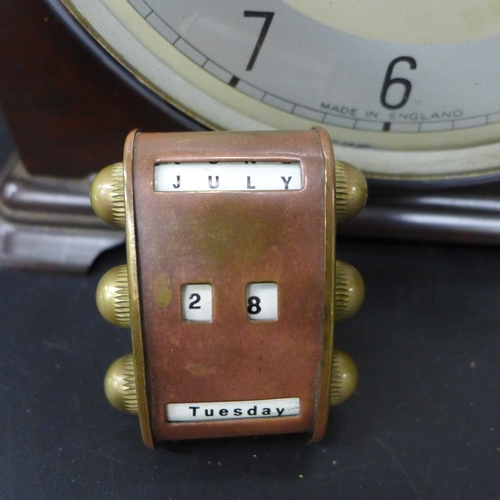 2046 - A Bakelite mantel clock by Enfield and a small copper and brass perpetual calendar, 19.5cm h