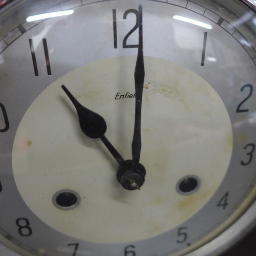 2046 - A Bakelite mantel clock by Enfield and a small copper and brass perpetual calendar, 19.5cm h