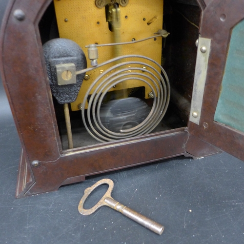 2046 - A Bakelite mantel clock by Enfield and a small copper and brass perpetual calendar, 19.5cm h