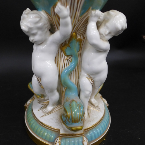 2048 - A late 19th Century Copeland porcelain vase, turquoise amphora shaped vase held by three putti figur... 
