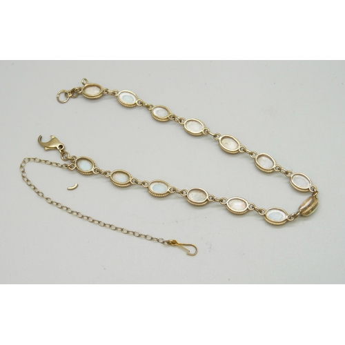 7056 - A 9ct gold and opal line bracelet, clasp a/f, 5.2g, 19.7cm